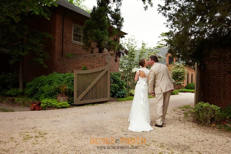 Great Oak Manor blue bride and groom at the gate