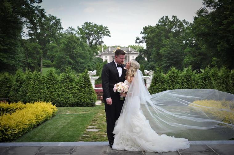Kerry Harrison NEmours waterfall wedding bride groom garden manor house blowing veil